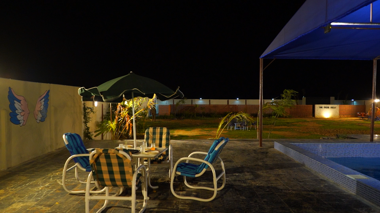Poolside seating area with lounge chairs